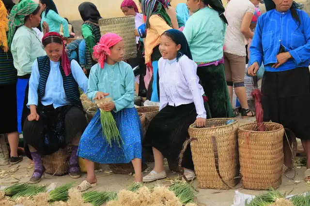 Happy smile of local girls going to the market
